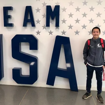 Steven in front of Team USA sign