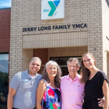 Picture of 4 adults in front of the Jerry Long YMCA