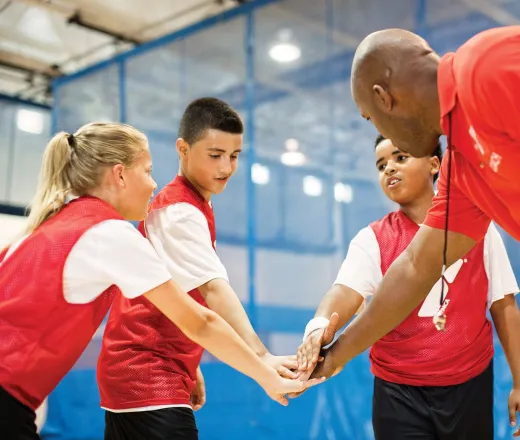 Basketball team and coach