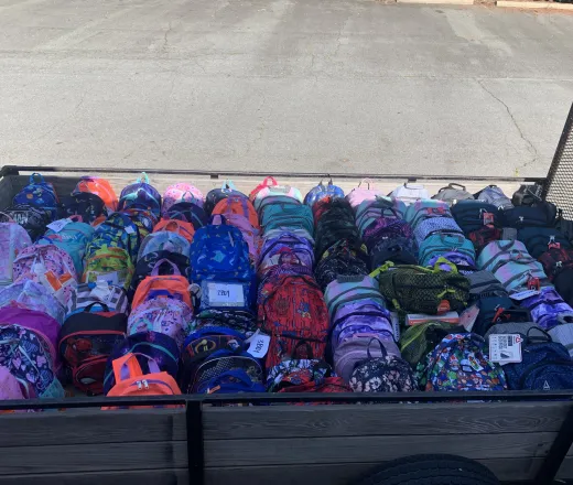 A truck bed full of backpacks
