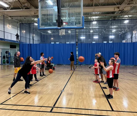 Kids lining up to pass a basketball