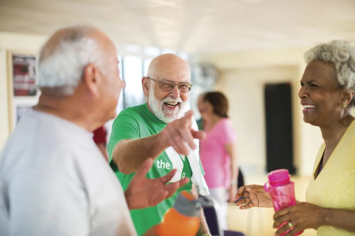 Three older adults smiling